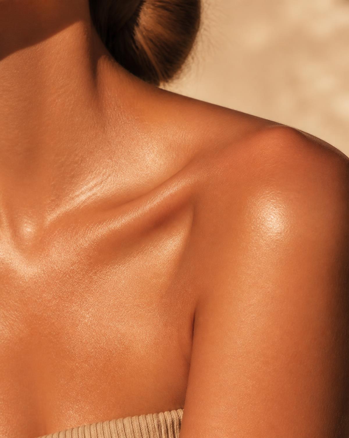 Warm, sun-kissed skin in soft golden light